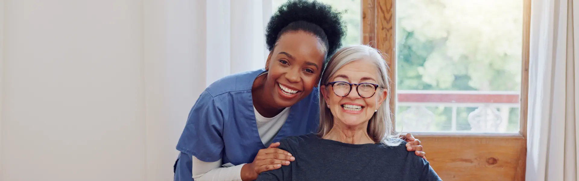caregiver and an elderly smiling