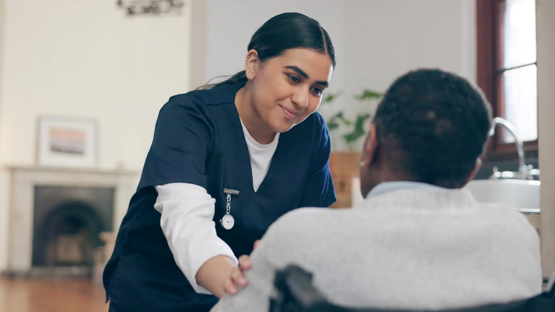 caregiver and an elderly talking
