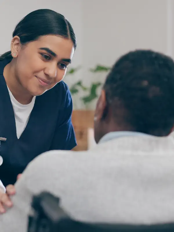 caregiver and an elderly talking