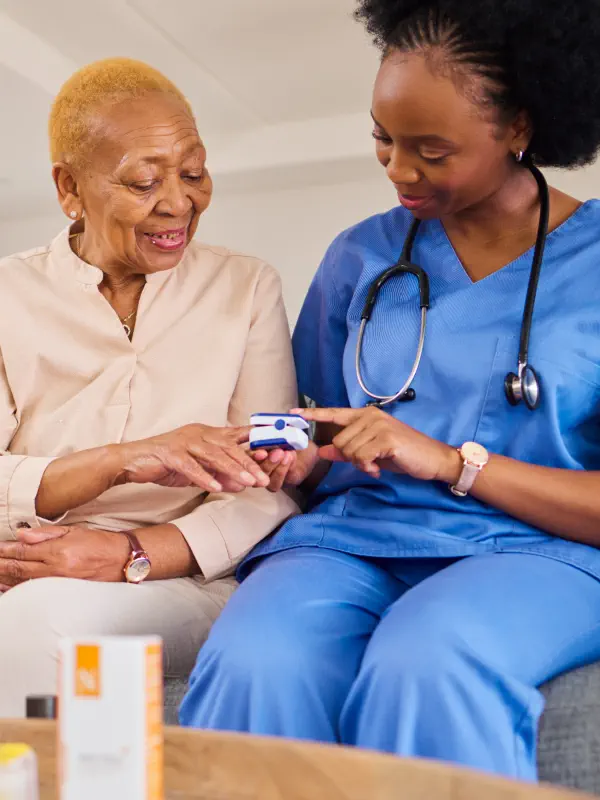 caregiver and an elderly talking
