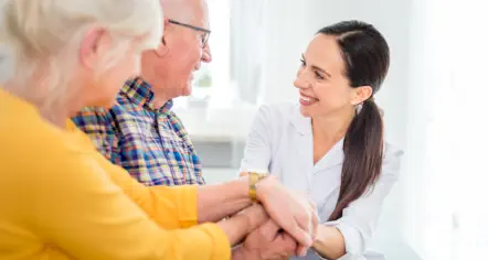 woman holding hand with elderly