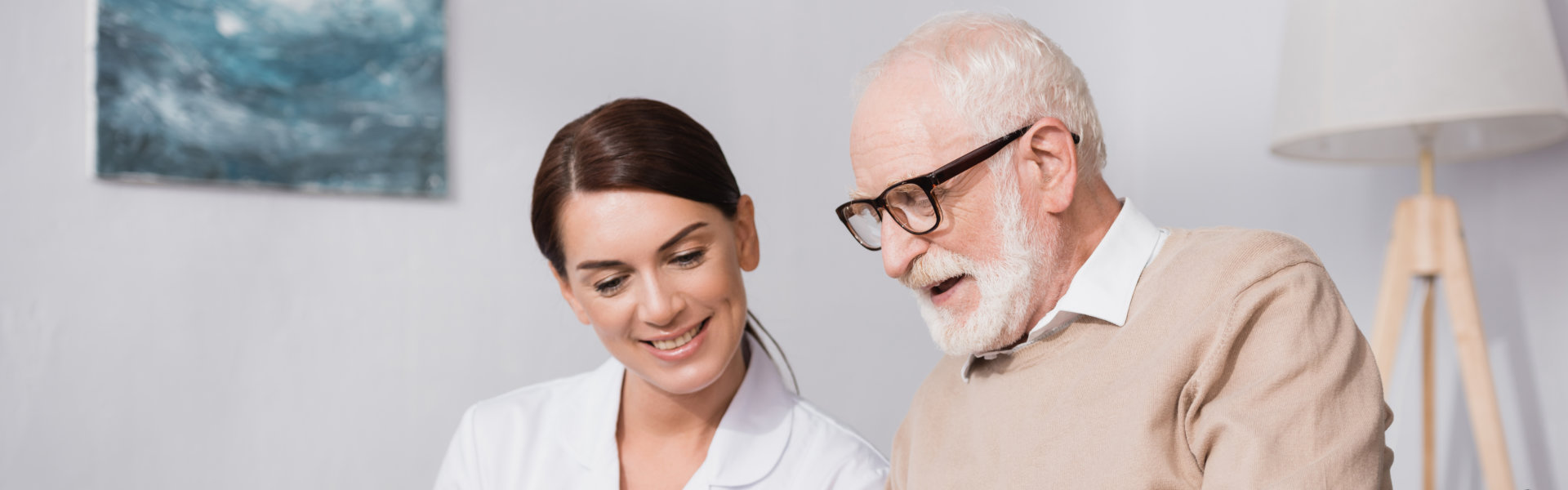 caregiver and an elderly talking