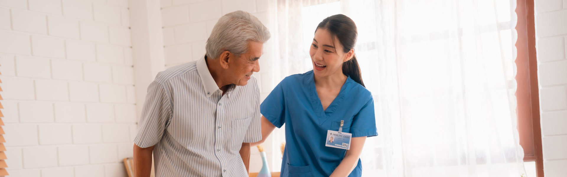 caregiver and an elderly walking